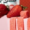 Strawberry Sour Belts candies and strawberry
