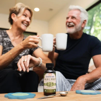 couple laughing with thc syrup in their drinks