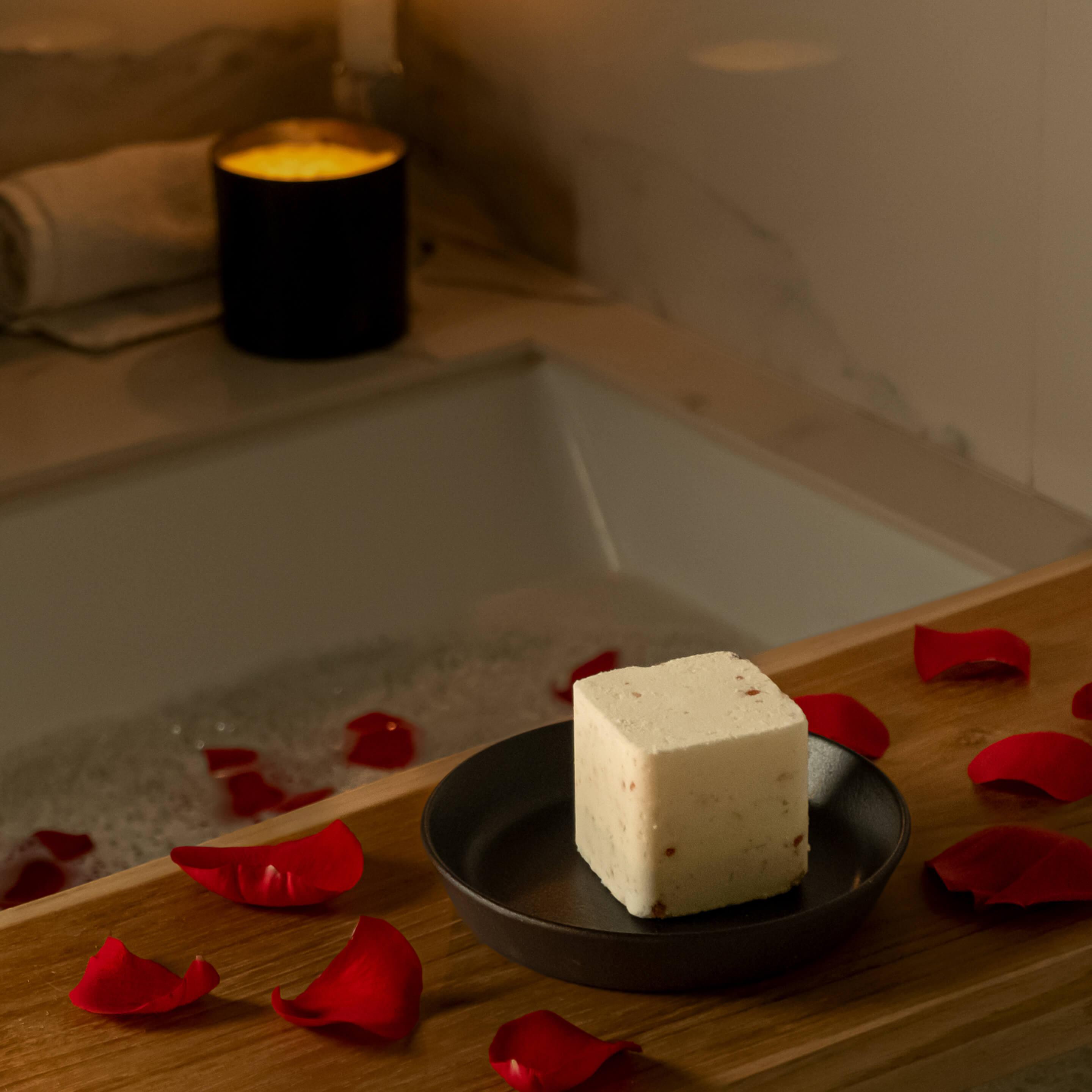 bath with rose petals and bath gem