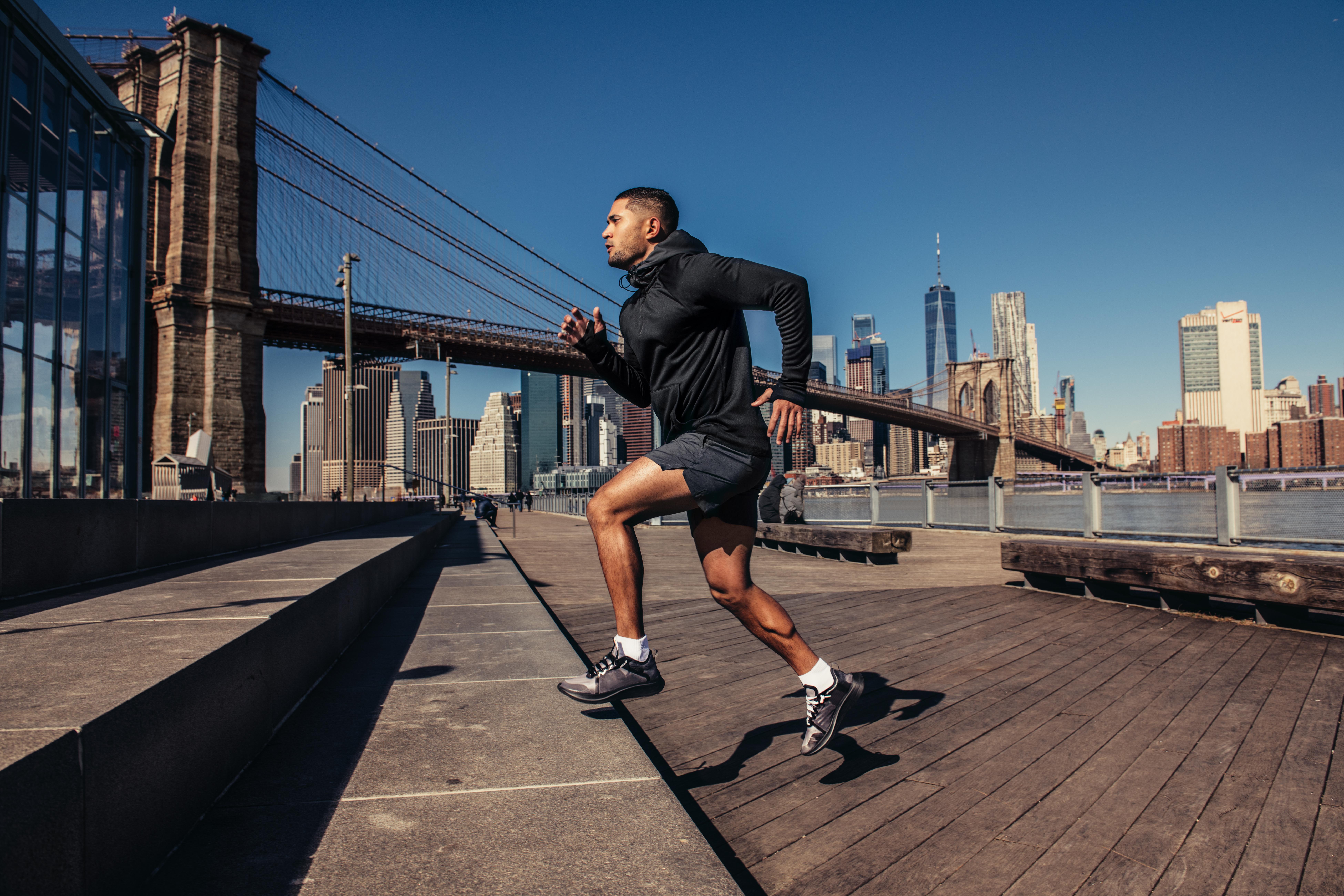 athletic man running in the city