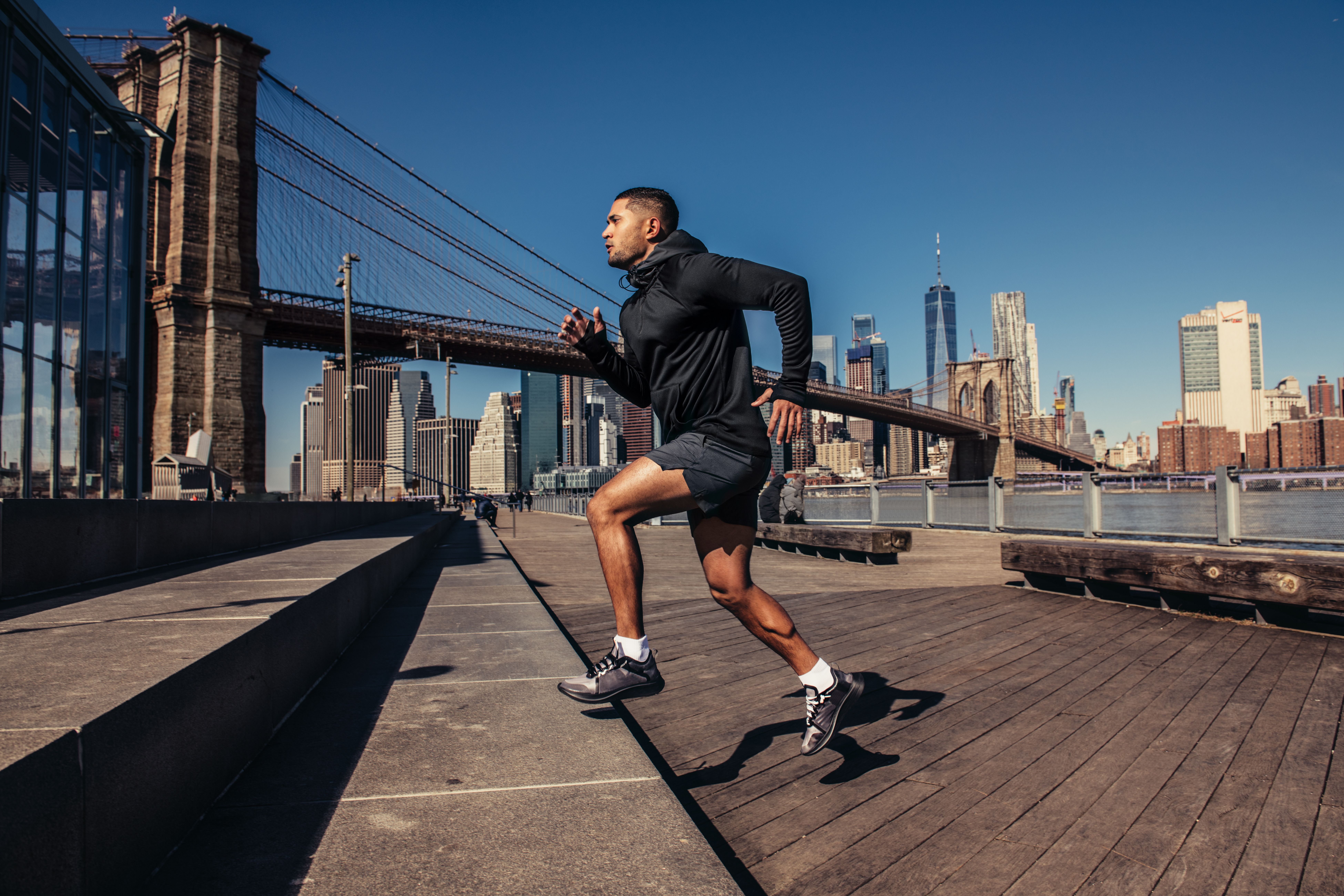 athletic man running in the city
