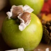 Apple Caramel Live Rosin Taffies on a Green Apple