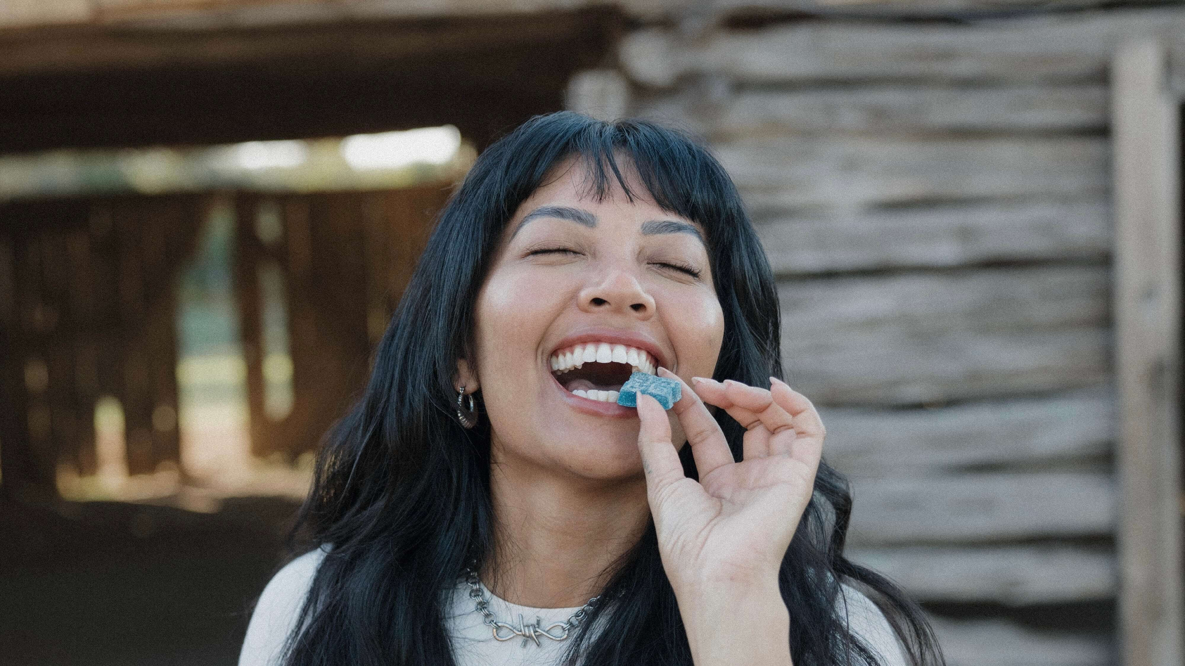 woman biting an edible