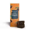 fudgy edible brownies stacked beside box
