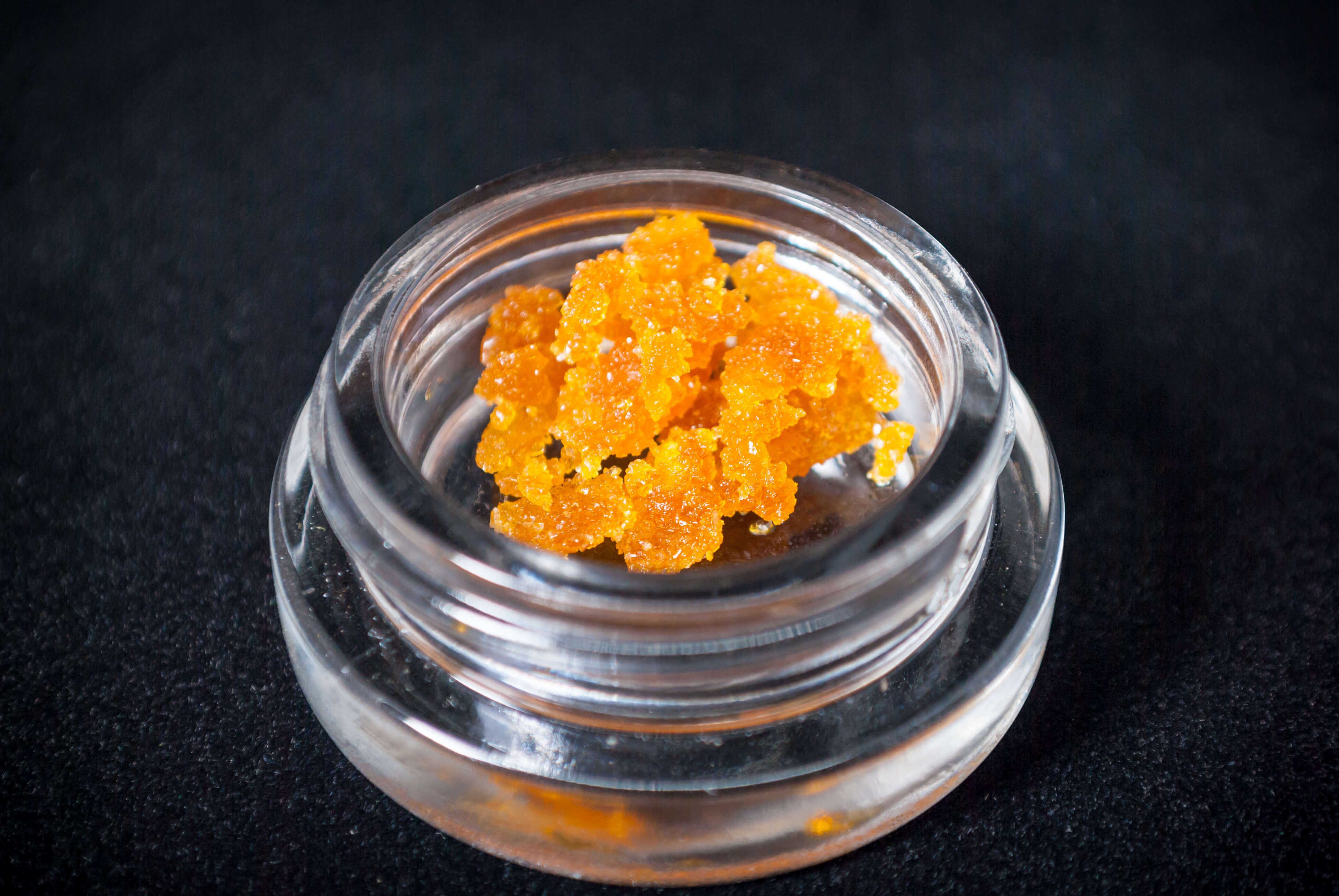 crumbly bright orange concentrate in a jar