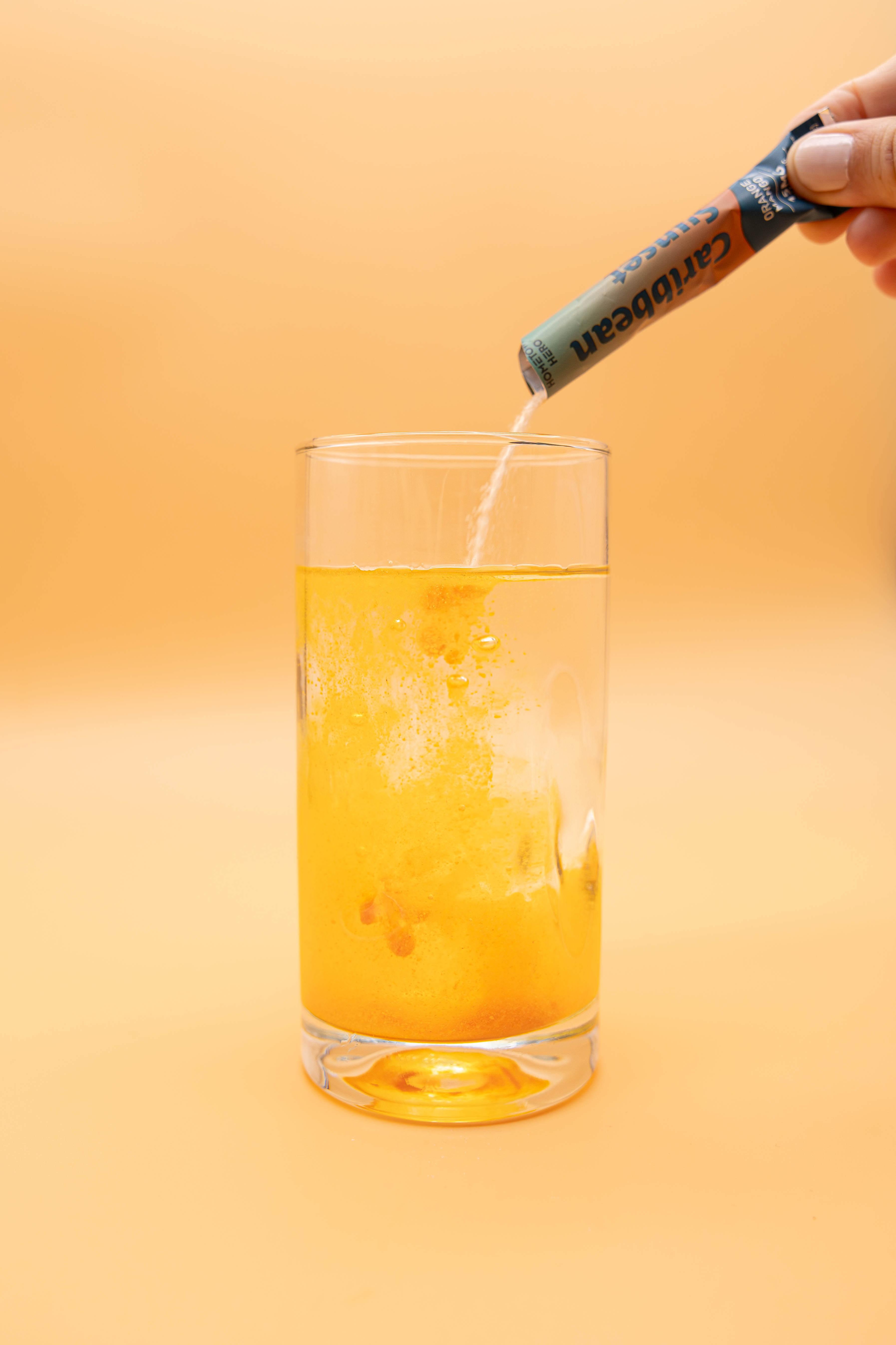 pouring drink mix into glass