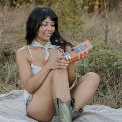 woman holding box of choc squares