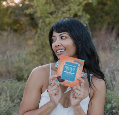 woman holding box of chocolate squares
