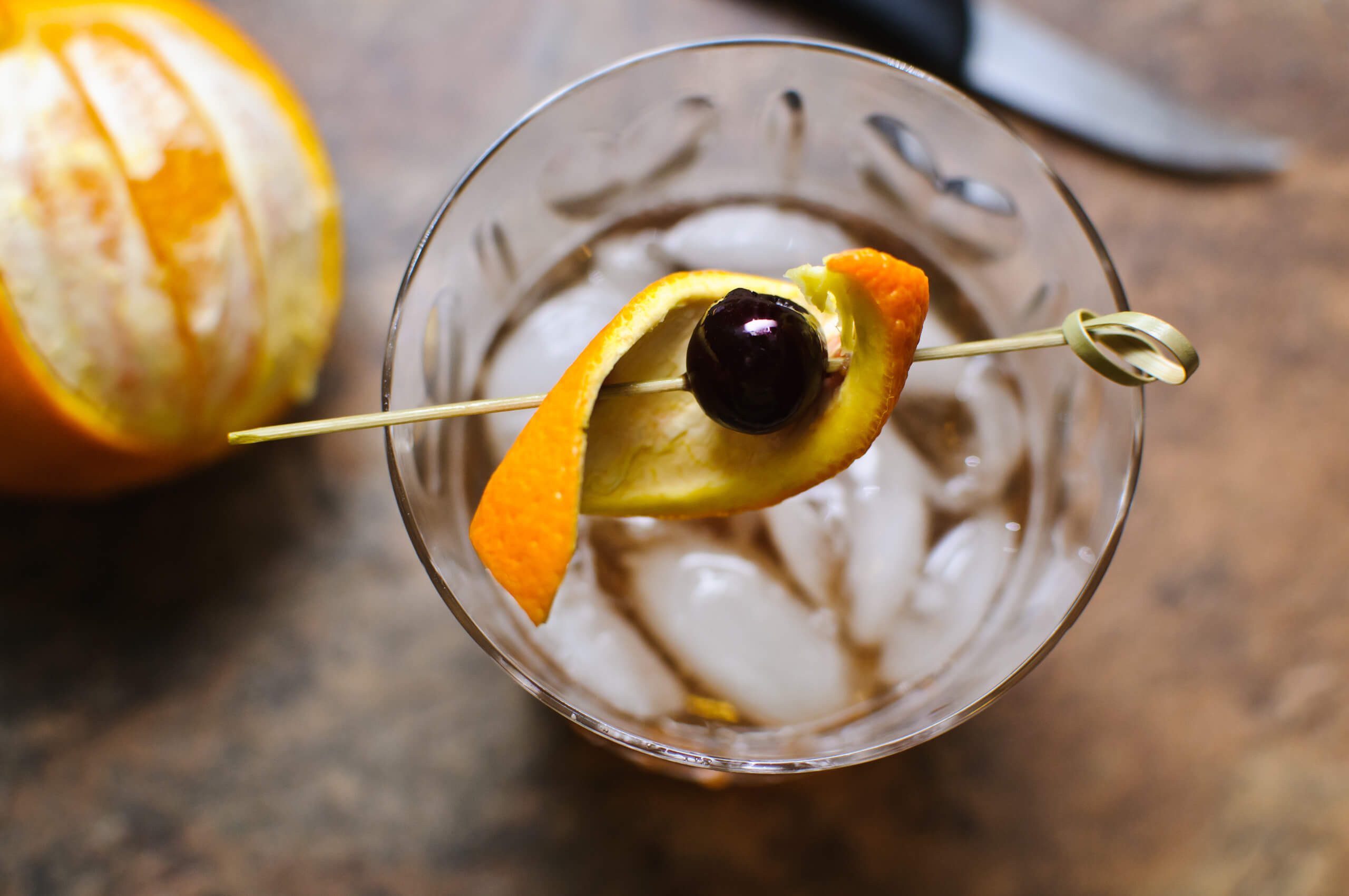 bitters and citrus on a cocktail glass