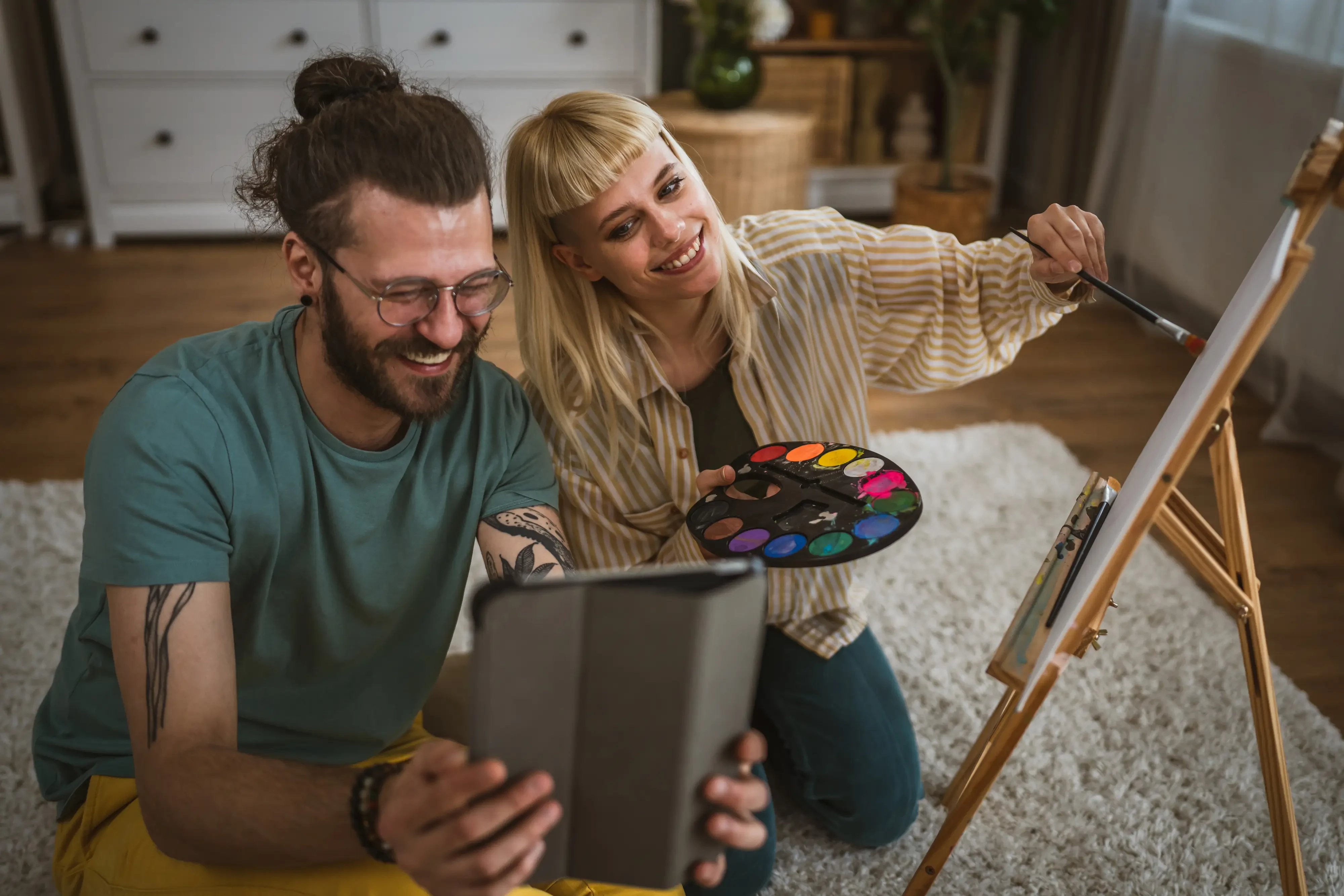 woman and man painting together