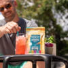 man stirring drink mix