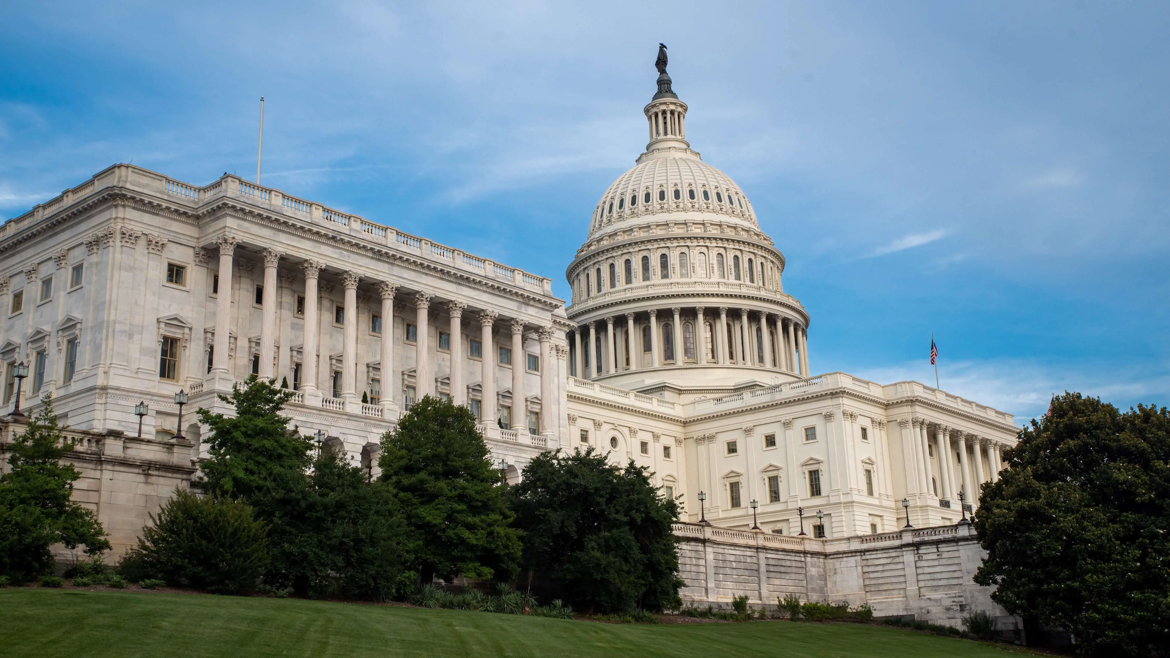 View of the marble domed United States Capital Building in spring home to legislative branch of federal government in Washington DC.