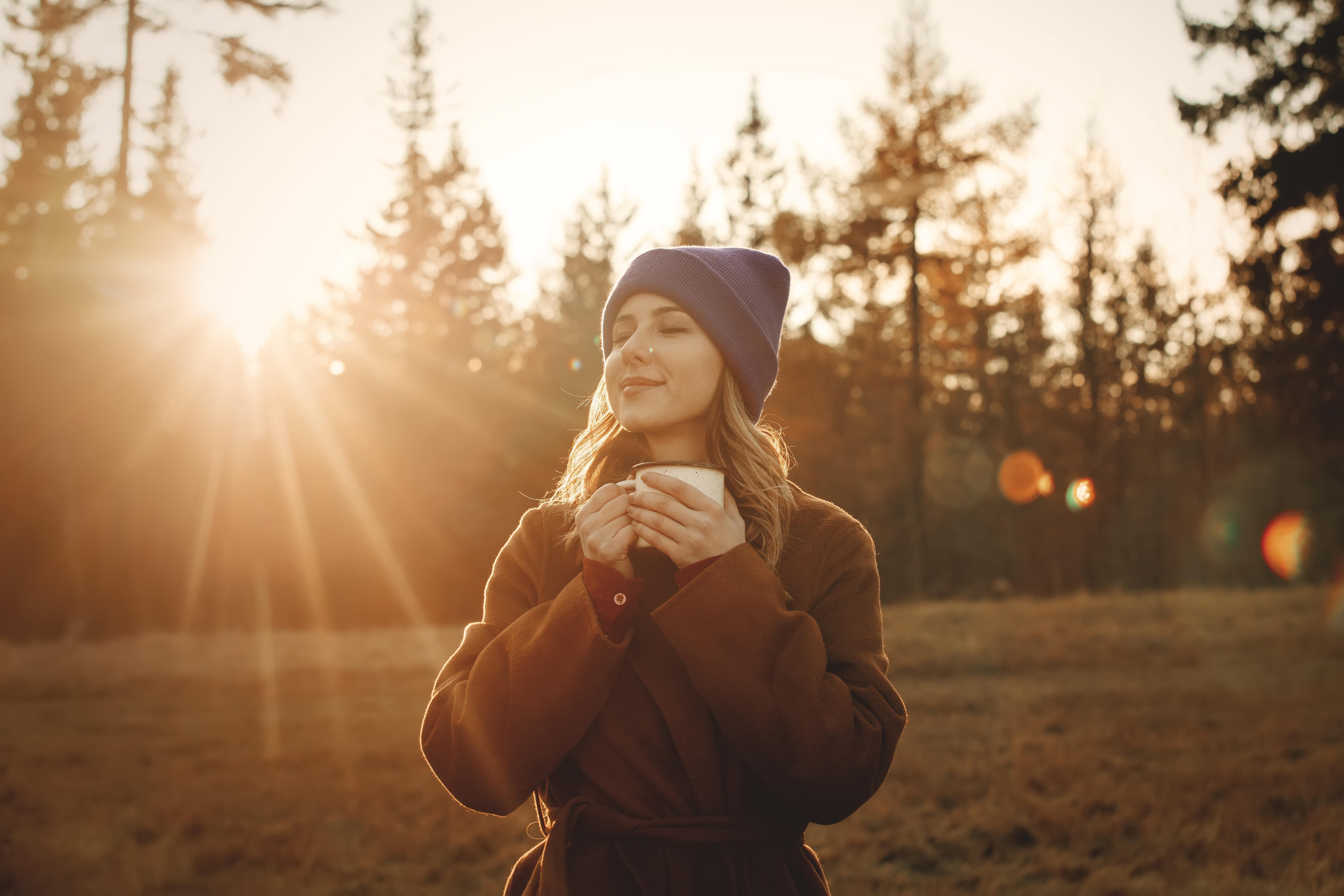 woman enjoying the autumn woods