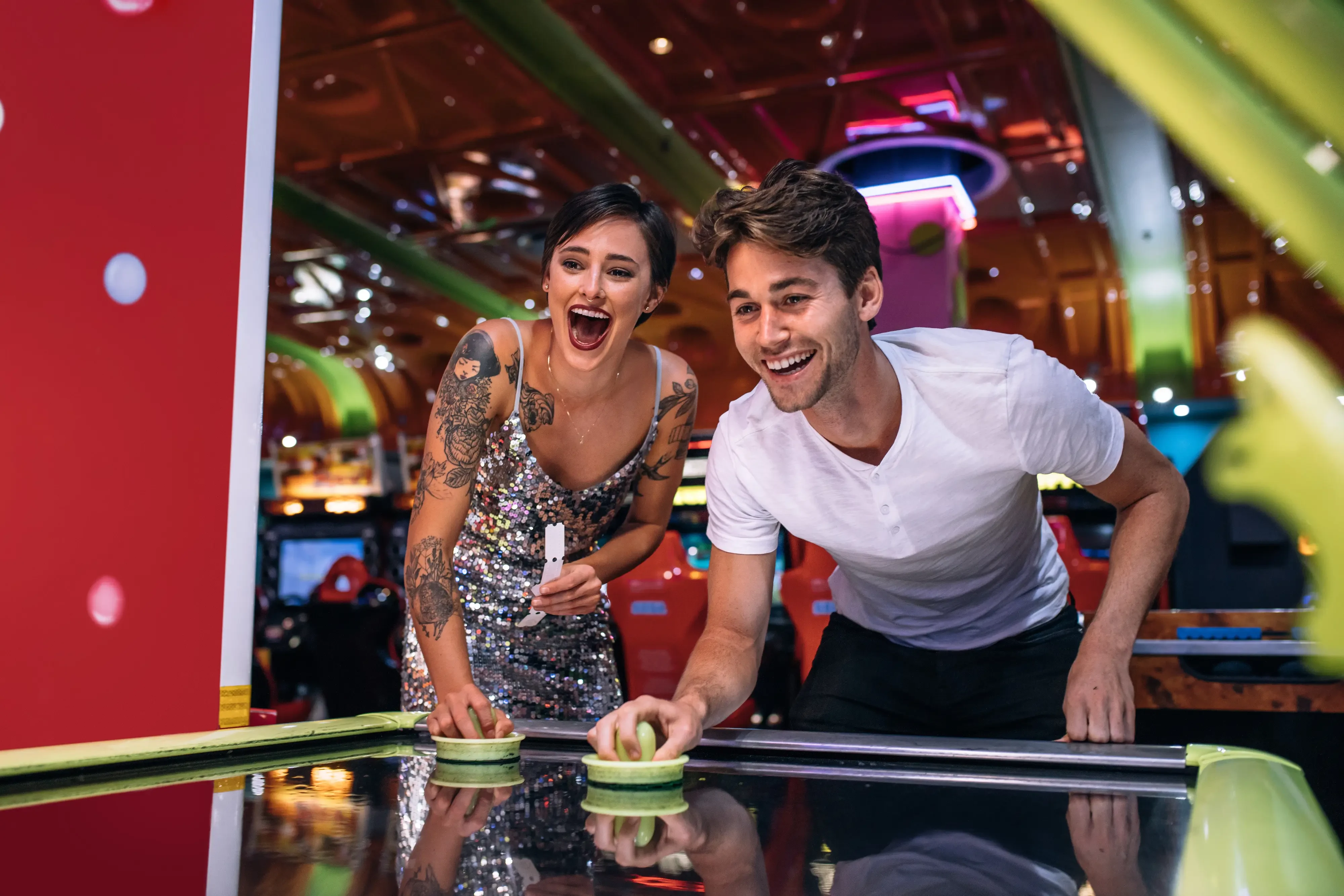 two young adults playing ski hockey