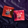 two bags of gummies on silk sheets