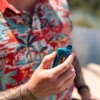 A man hand holding a vape