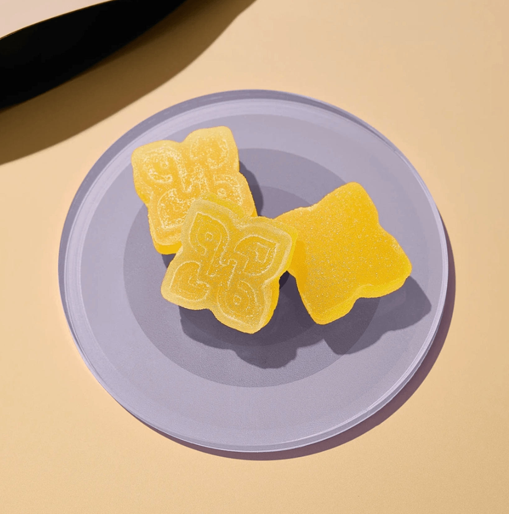 honey lemon ginger double take gummies on plate