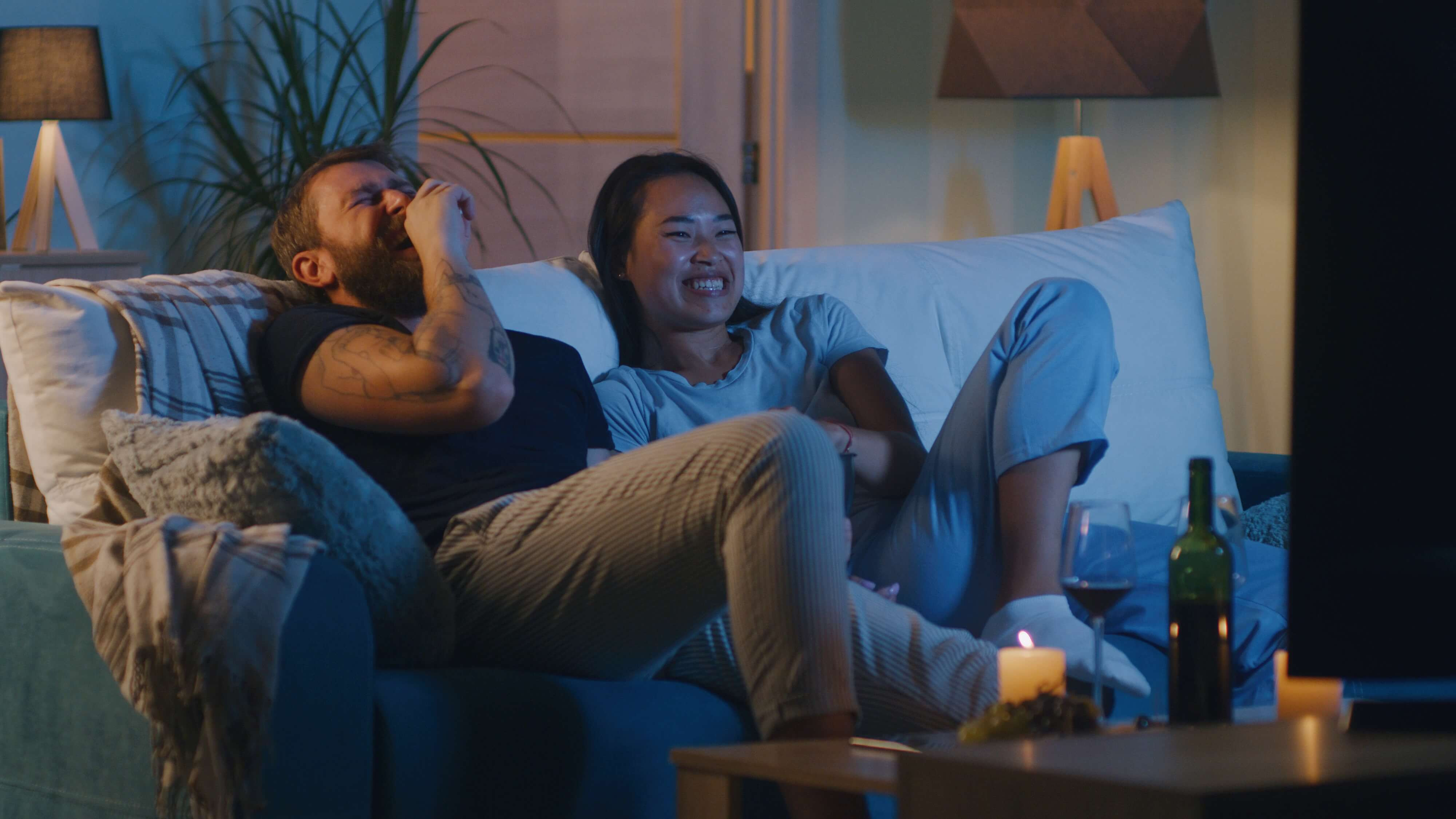 couple laughing watching movies