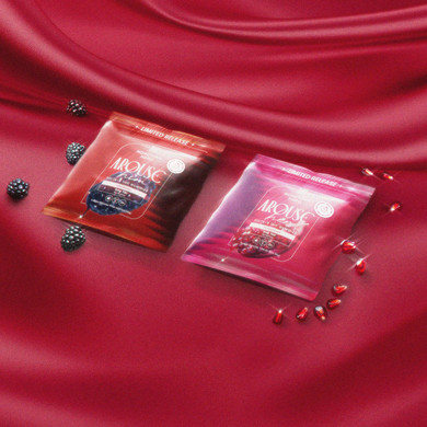 two bags of gummies on red sheets