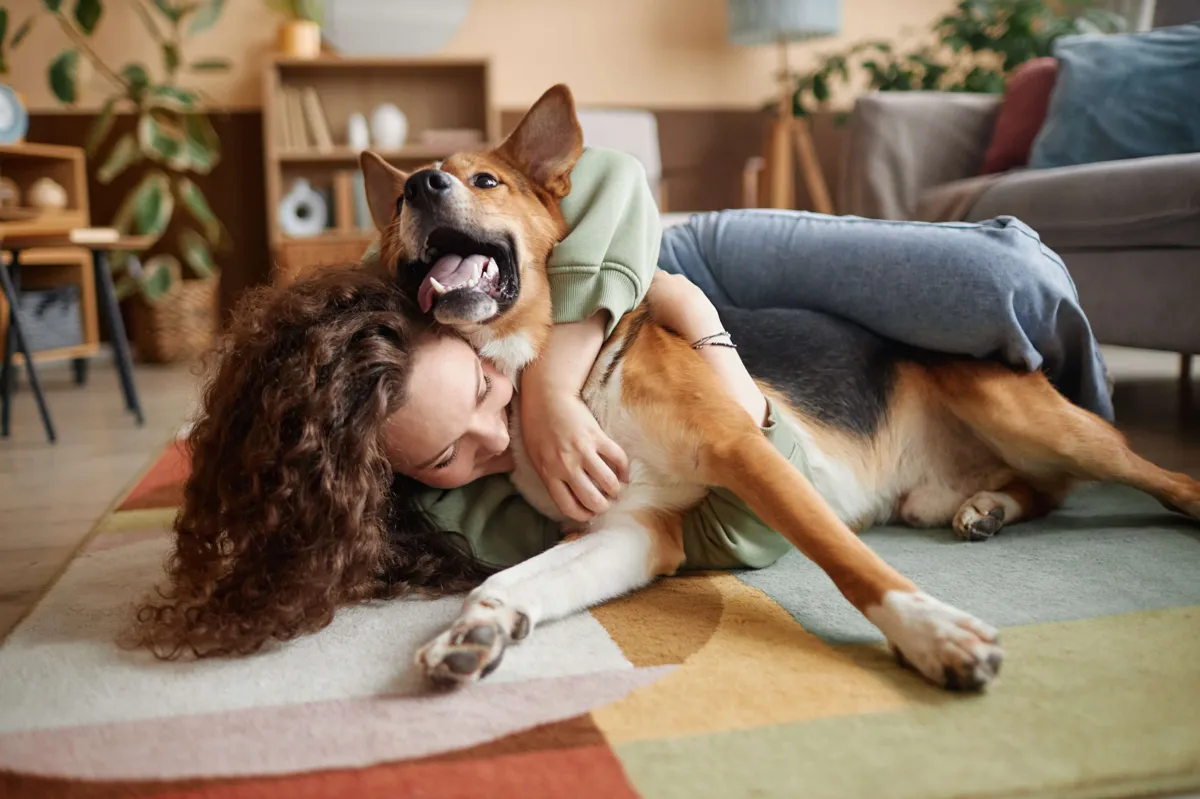 woman loving her dog