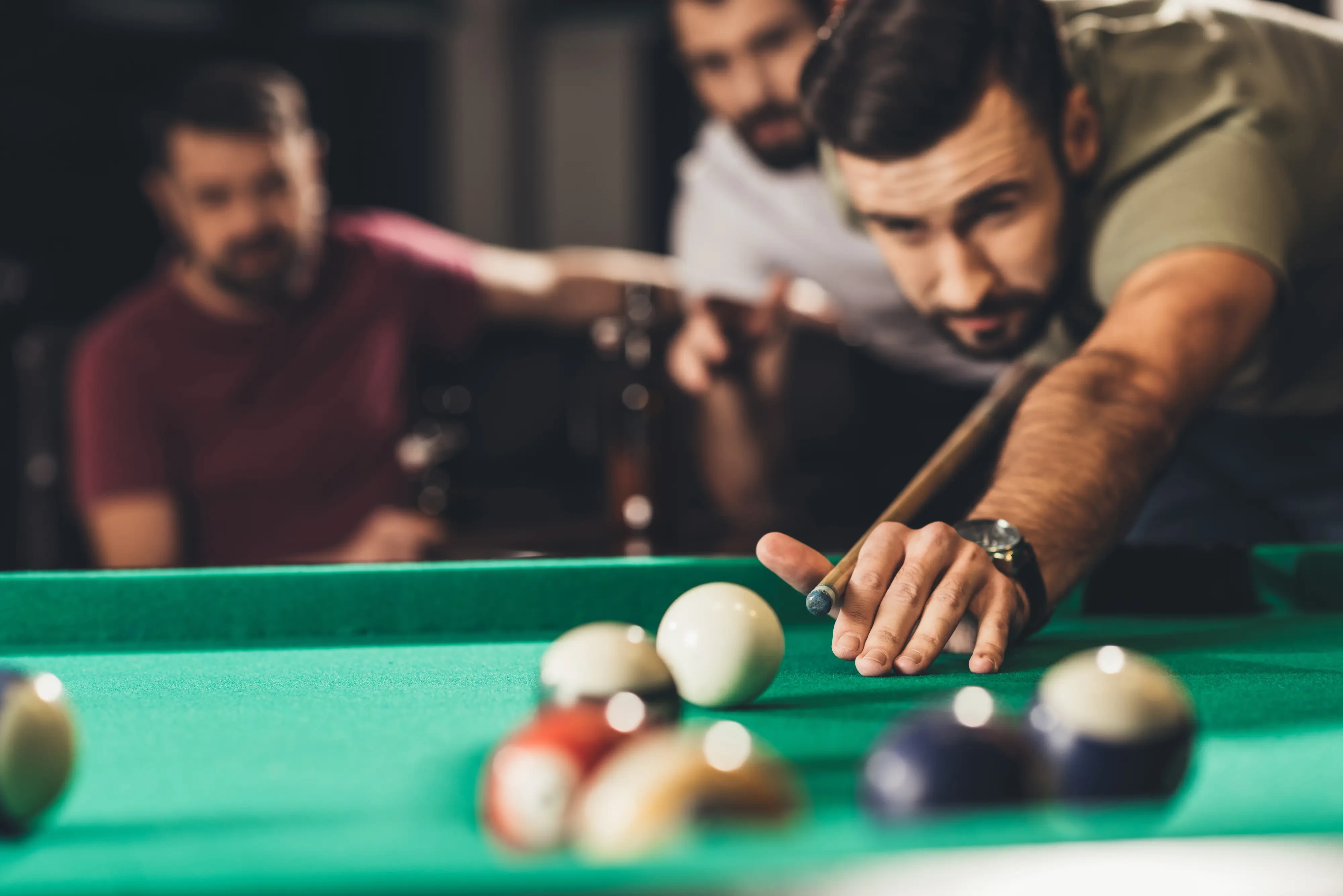 man playing pool