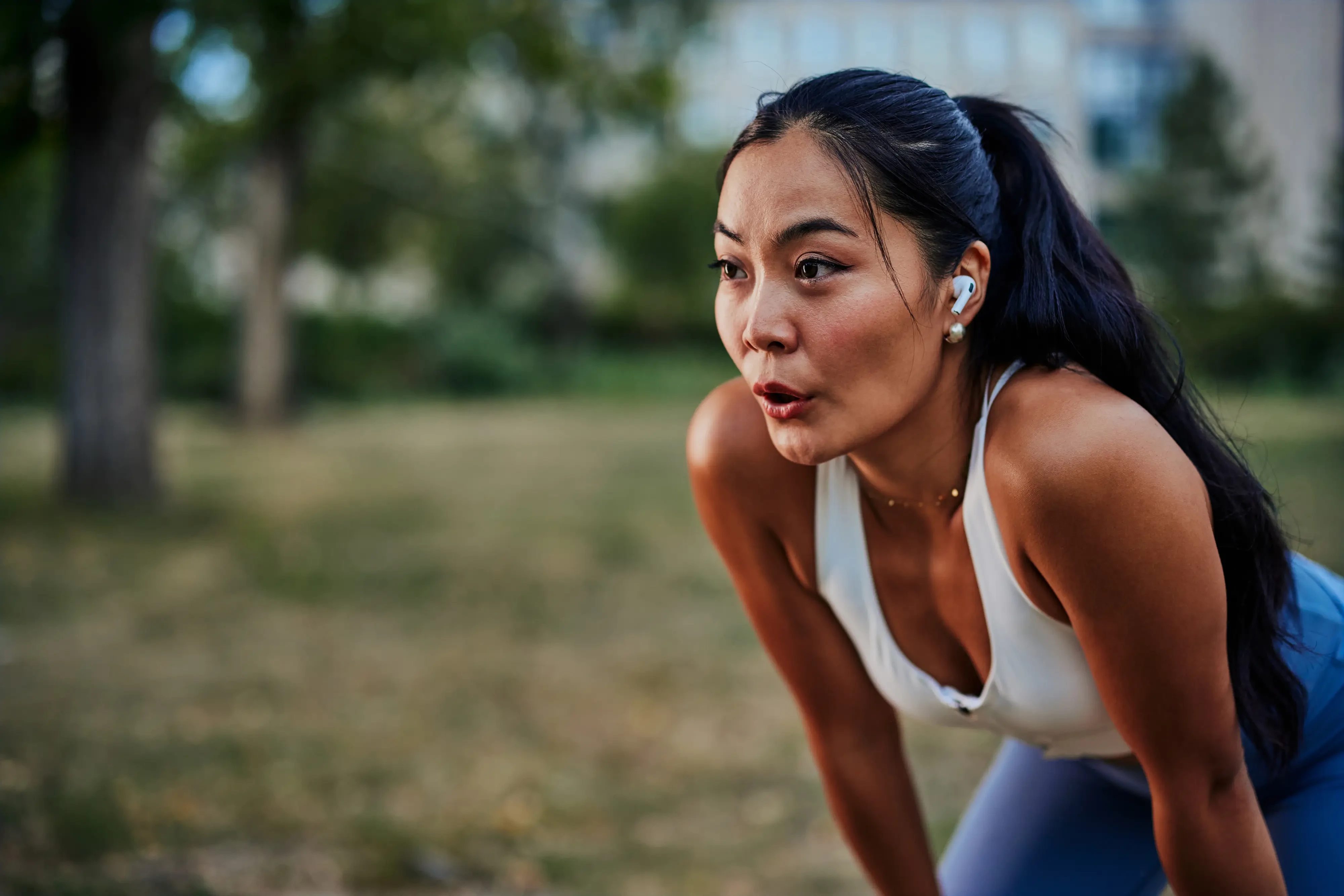 athletic woman exhaling after a rigorous workout