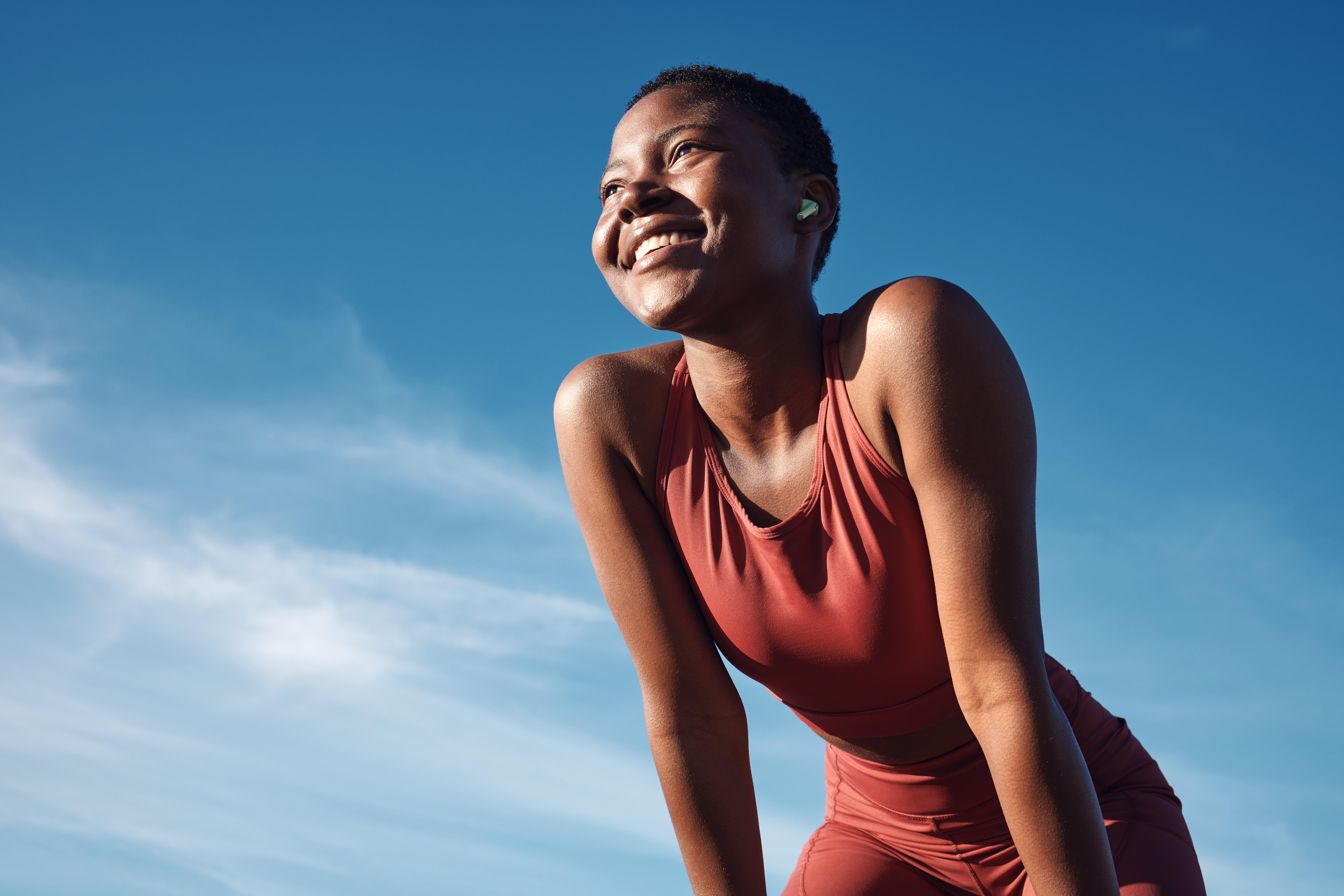 woman on a run smiling
