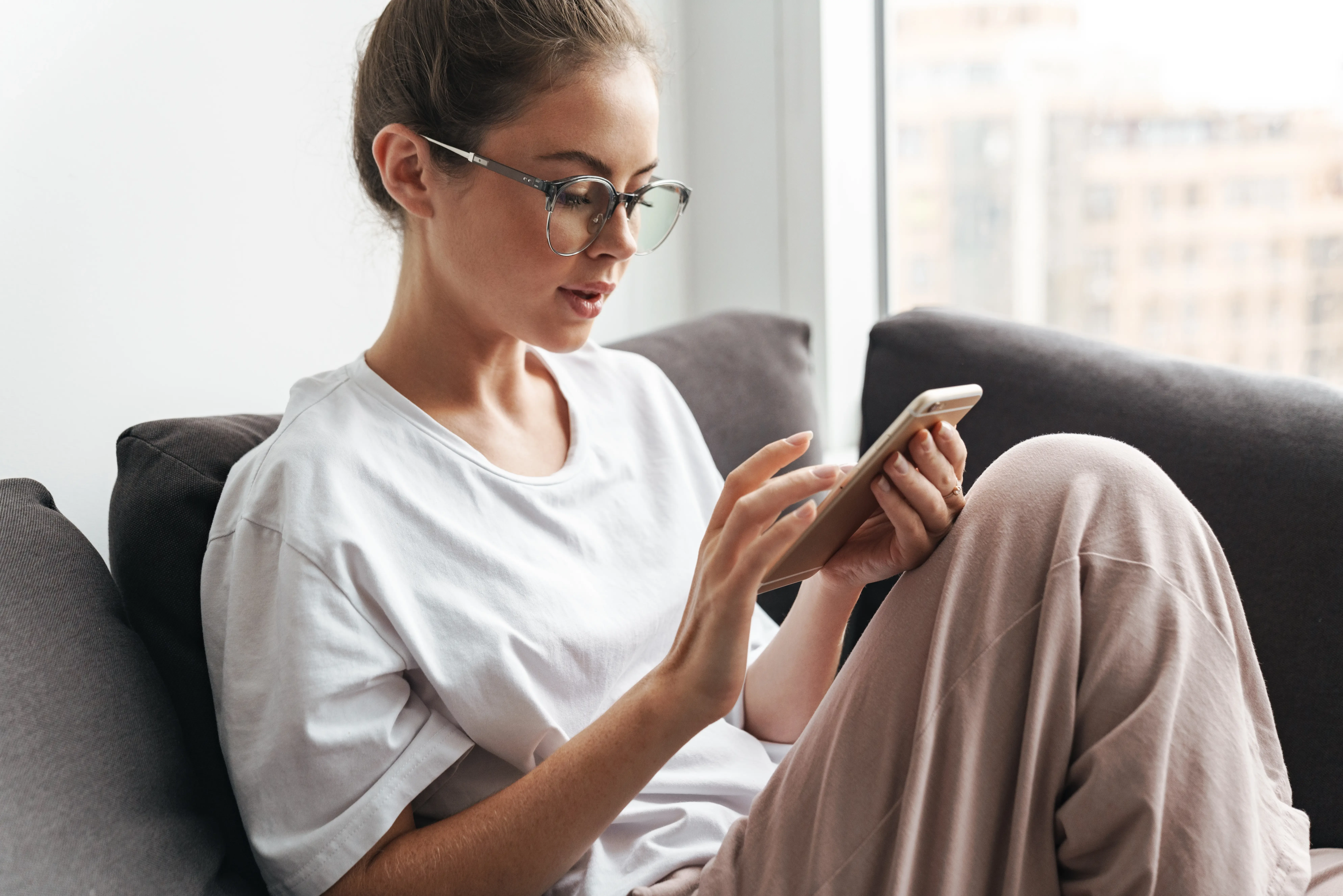 woman shopping on her phone for thc products