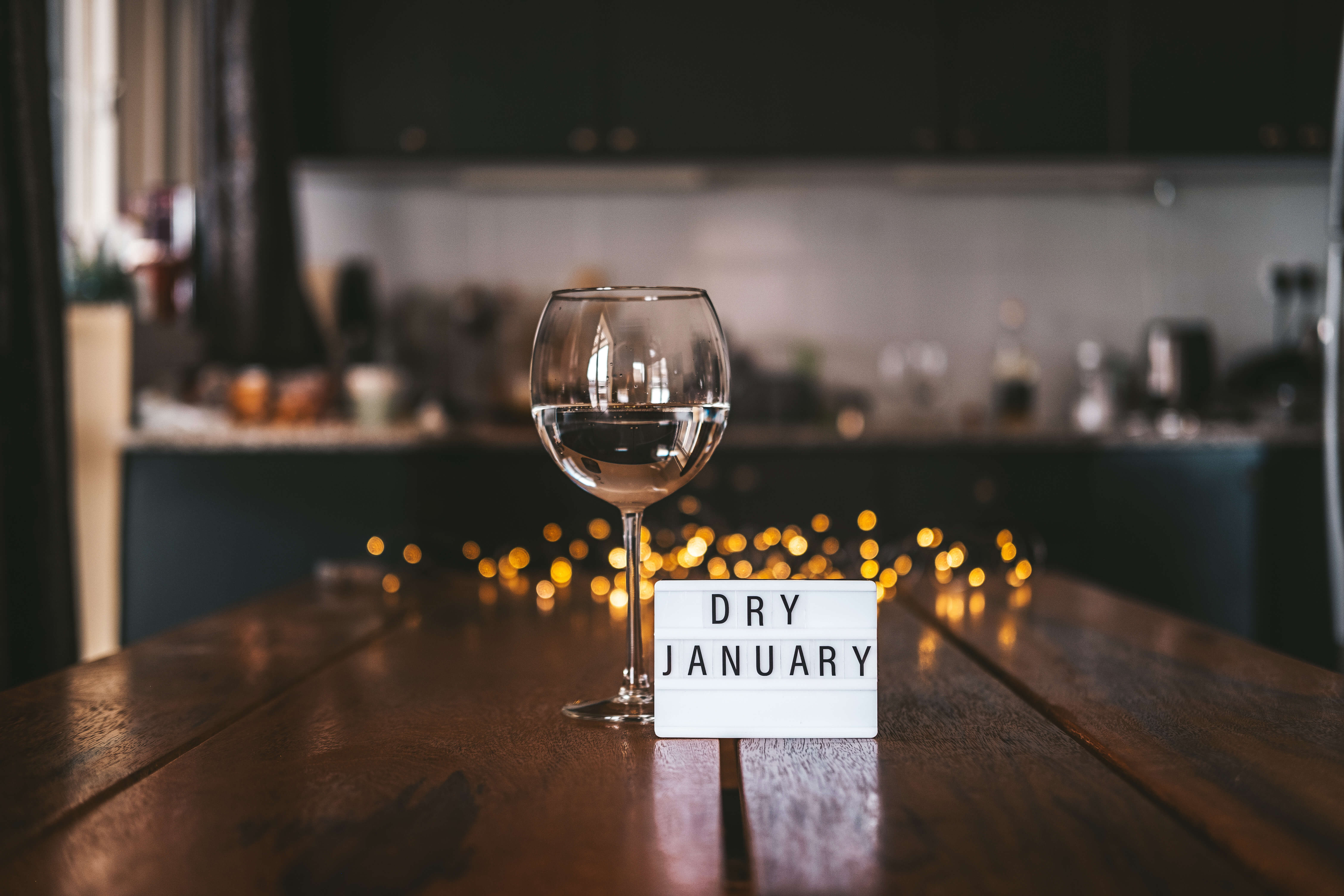 dry january sign next to bottle of wine