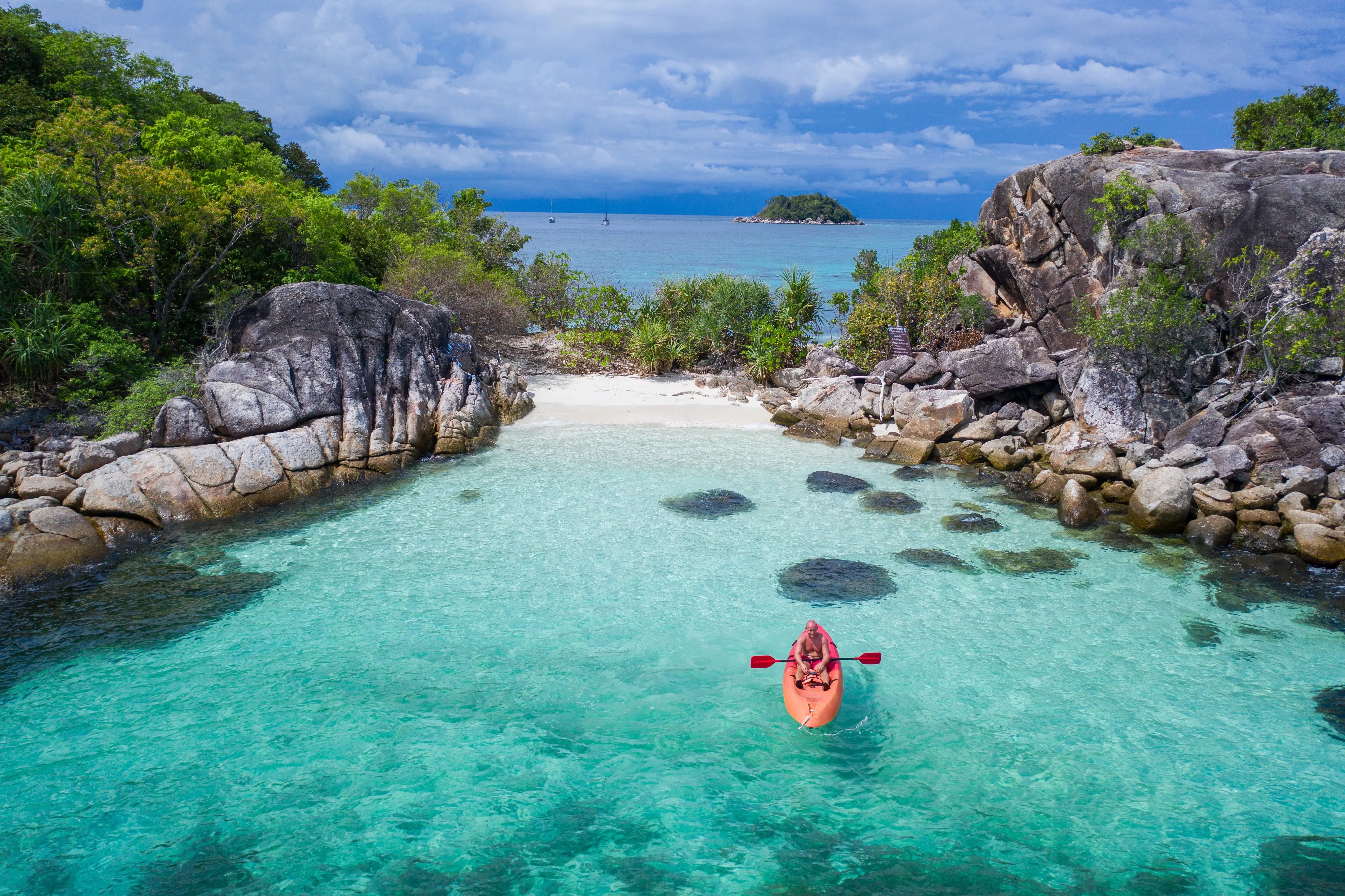 woman riding a boat in the south pacific