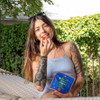 woman eating a super silver haze gummy