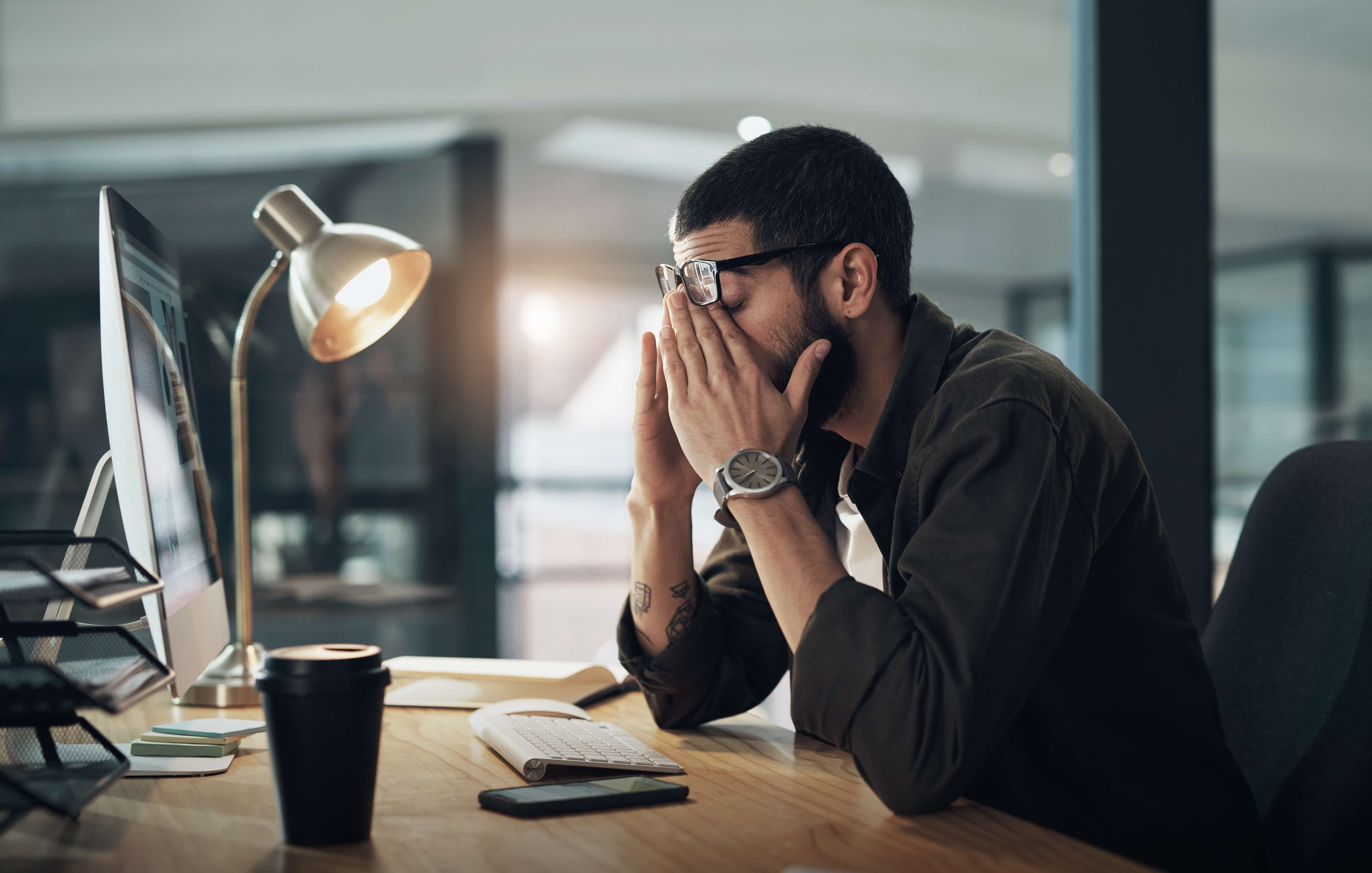 man swamped at work, stressed out