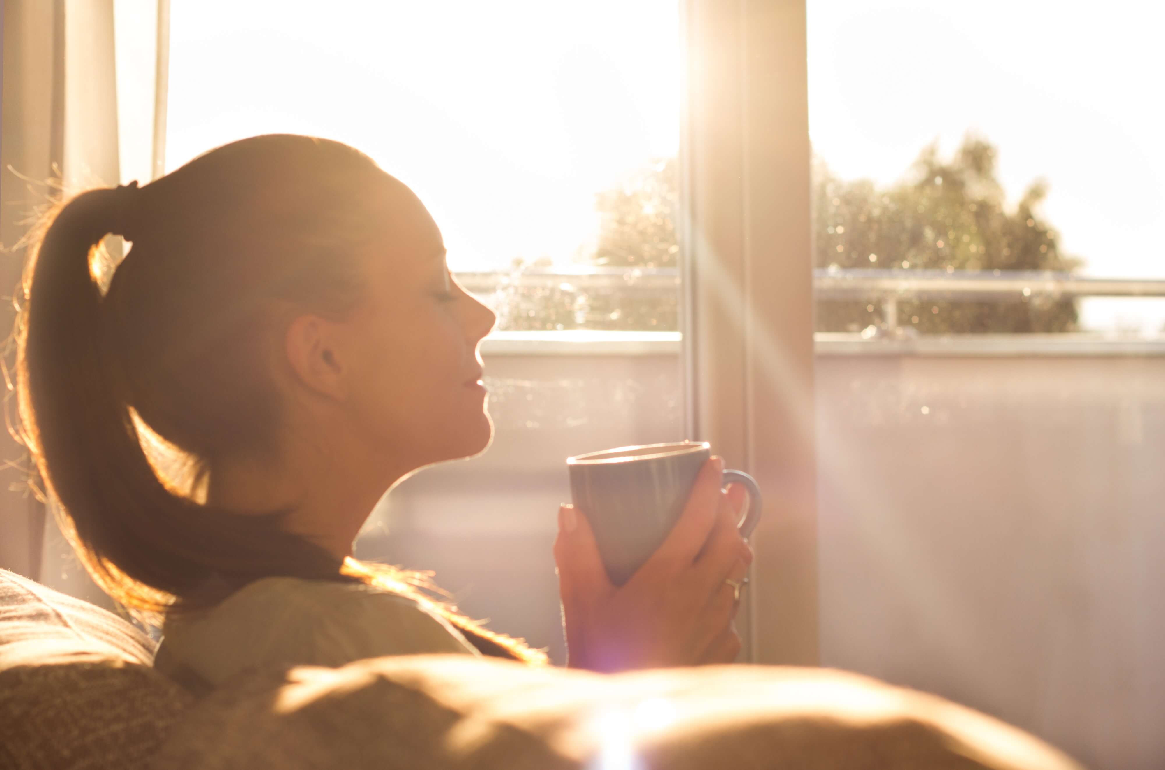 woman enjoying coffee in the morning