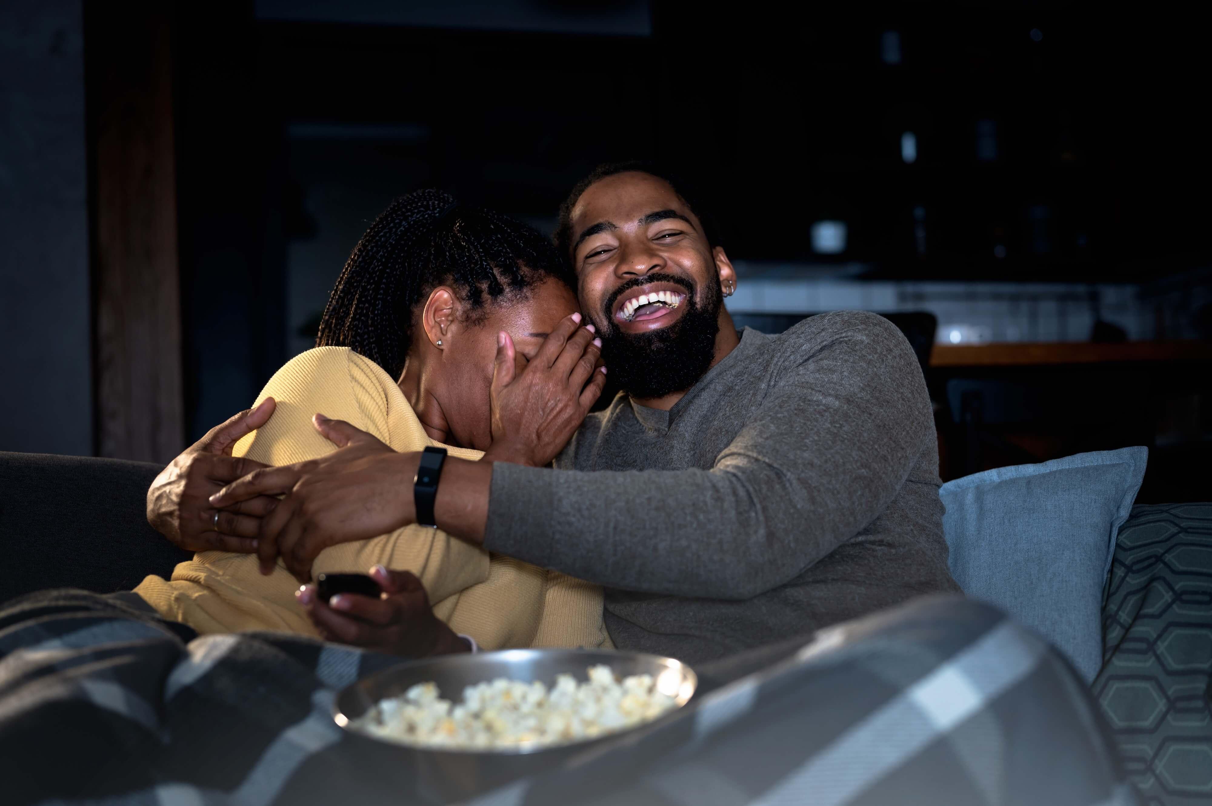 couple watching scary movies together