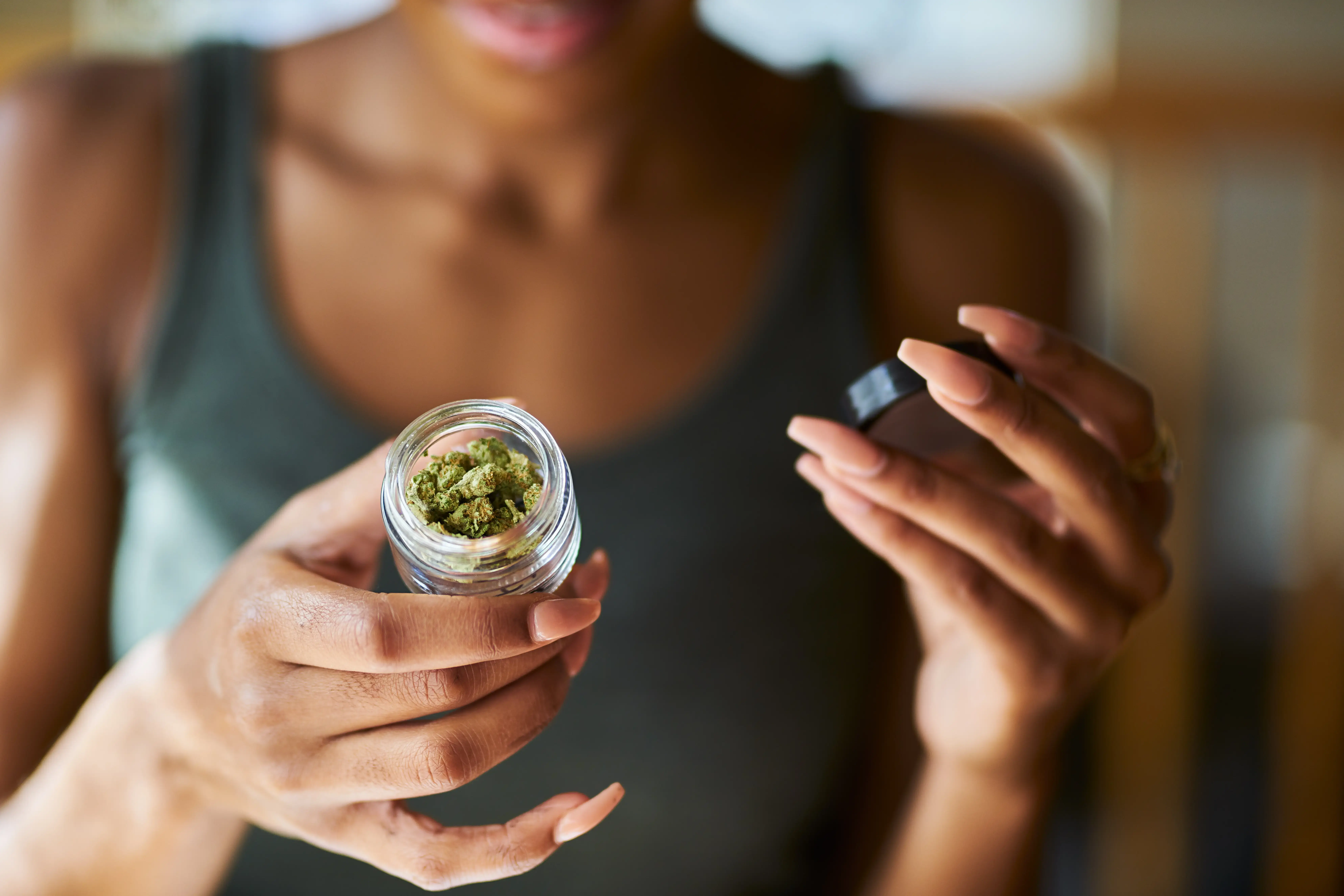 woman reading weed container